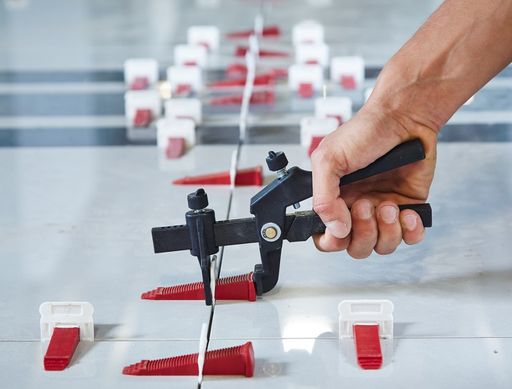 A tile leveling system makes tiling more efficient.